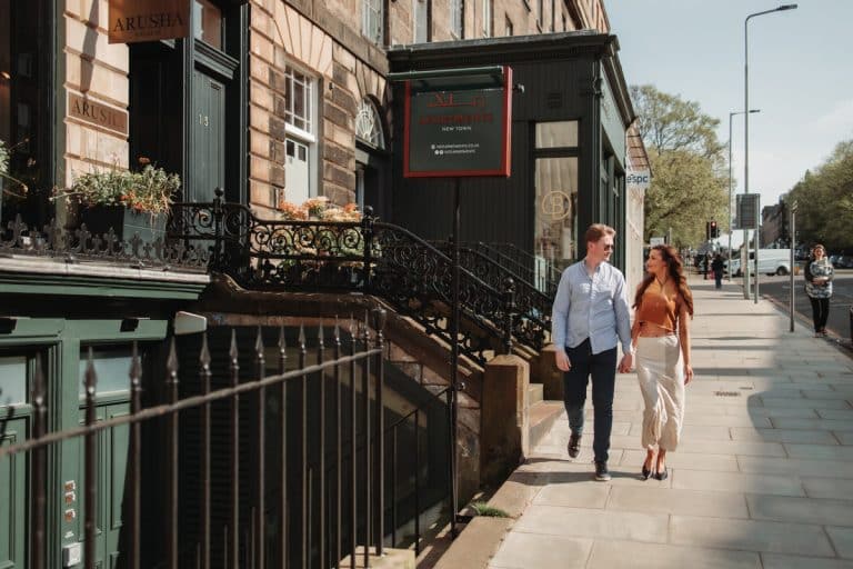 couple walking in edinburgh